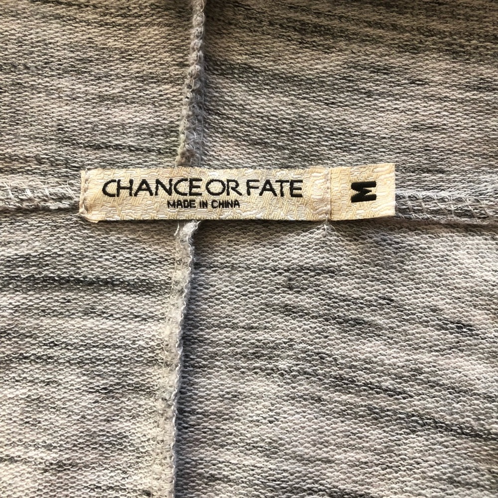 Silver cardigan. Lightly worn. Size M juniors